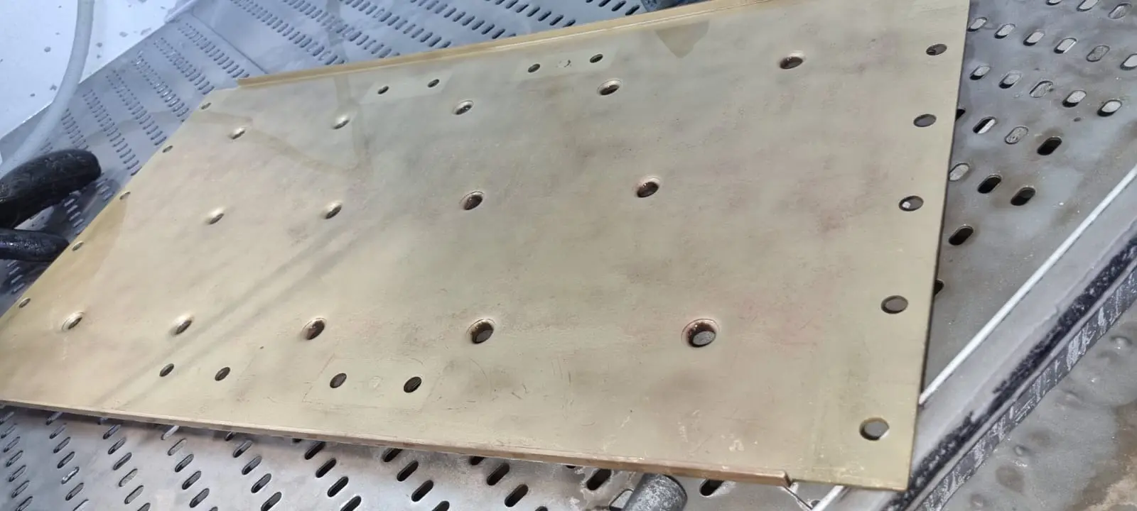 Restored brass panel after vapour blasting